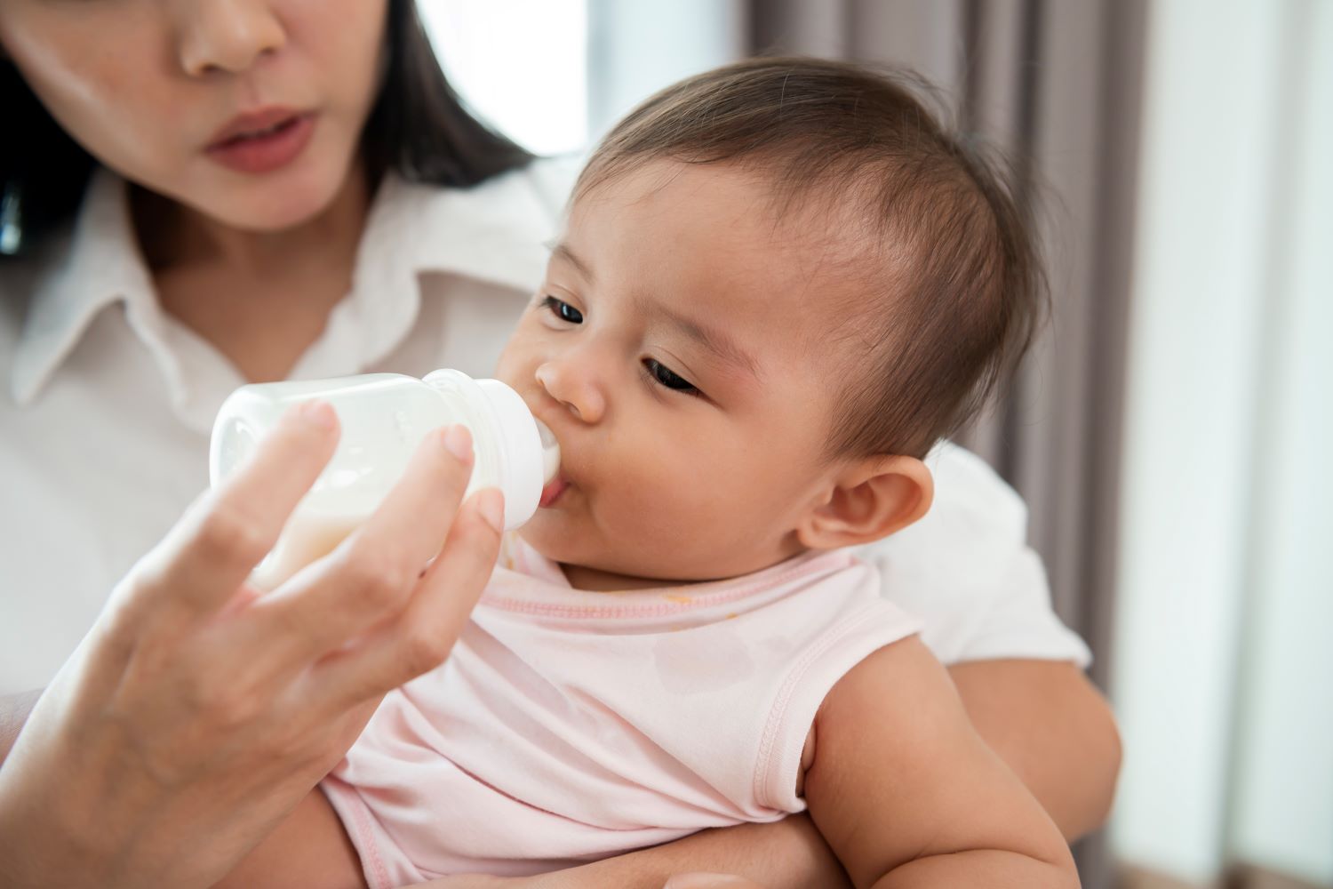 My child often vomits after finishing their milk.